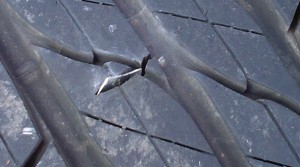 flat tyre with large metal piece in it